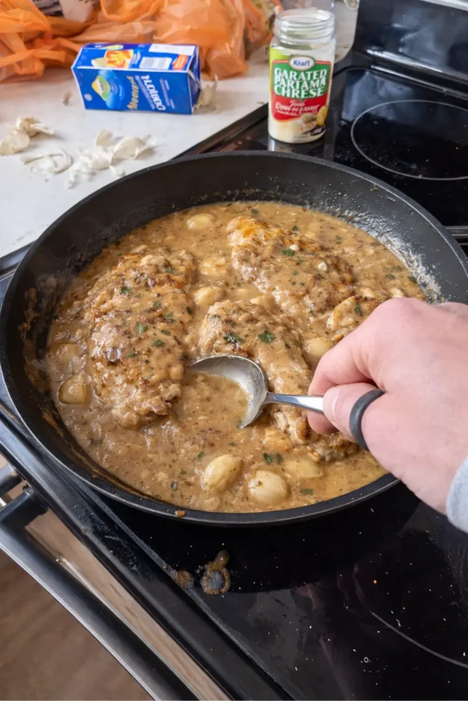 Creamy Garlic Chicken in a rich garlic Parmesan gravy, made in one skillet with whole caramelized garlic cloves